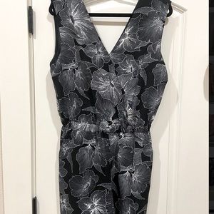 Black Romper with white floral design and pockets